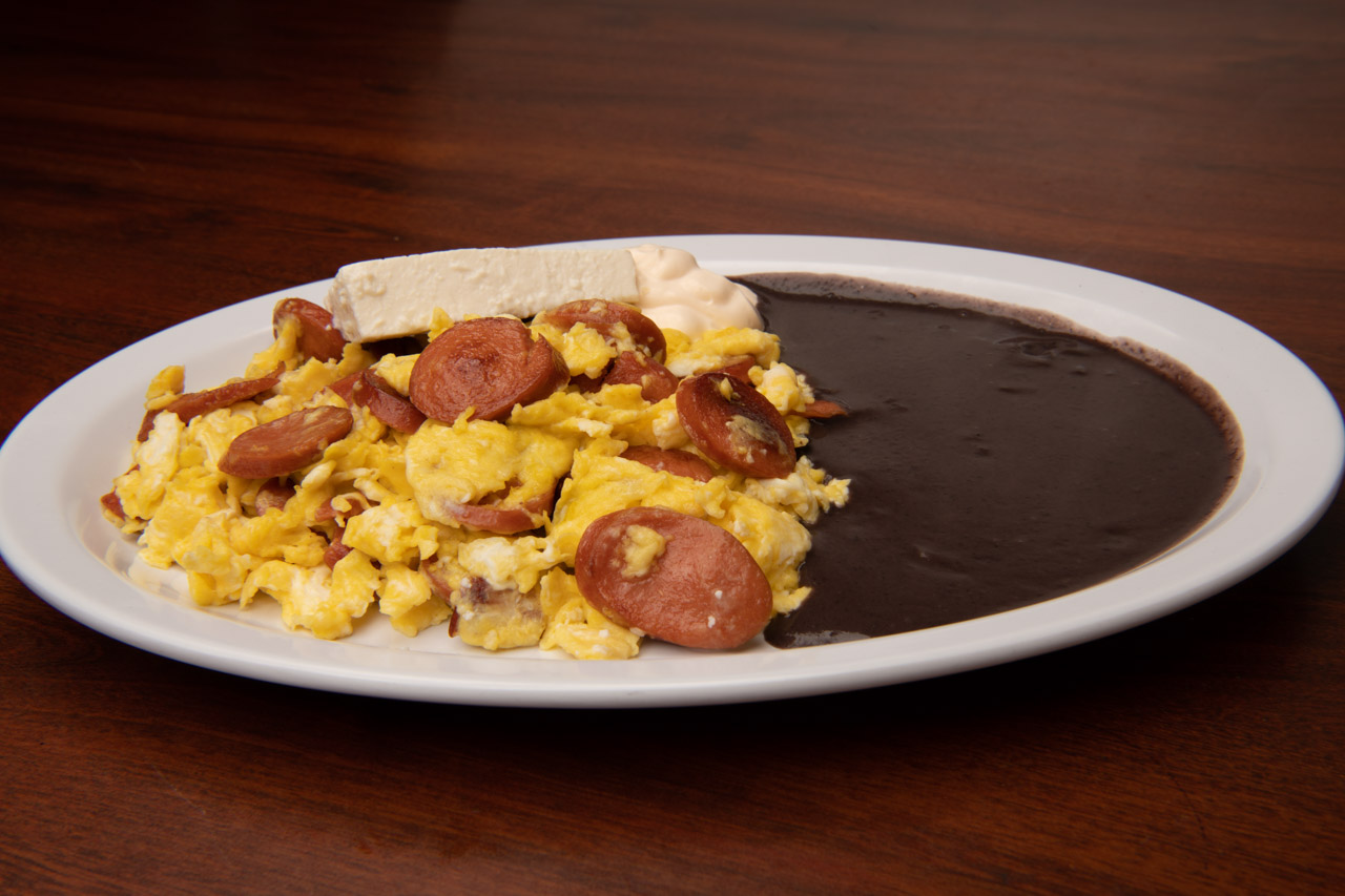 Huevos con chorizo (Scrambled eggs with sliced sausage) Tipico Quetzal Restaurant El Tipico
